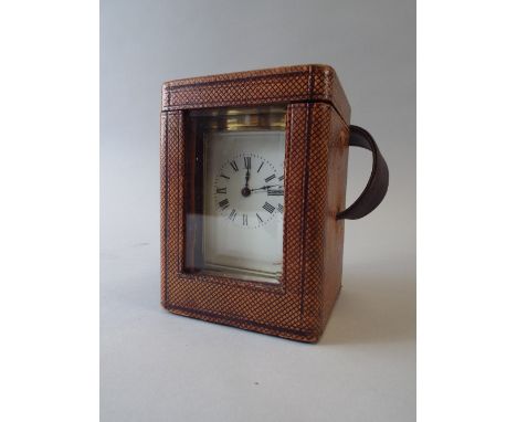 A Brass Carriage Clock in Carrying Case. Eight Day Movement, White Enamel Dial and Roman Numerals. 
