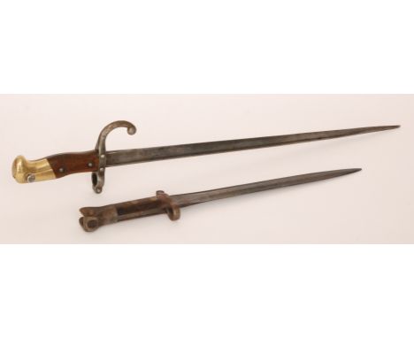 A late 19th Century French socket bayonet inscribed and dated 1880, 48.5cm blade and a British First World War bayonet (2)