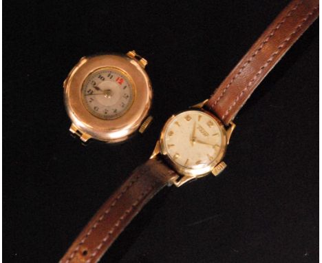 A 1950s 9ct lady's Tissot wrist watch, the circular cream dial with Arabic numerals and dart marks, dial diameter 16mm, fifte
