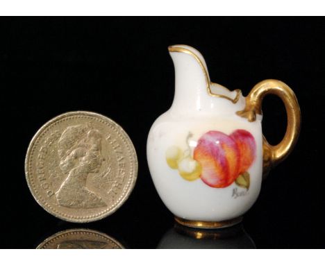 A miniature Royal Worcester flatback jug decorated by Burt with hand painted apples and cherries, signed, puce mark with date
