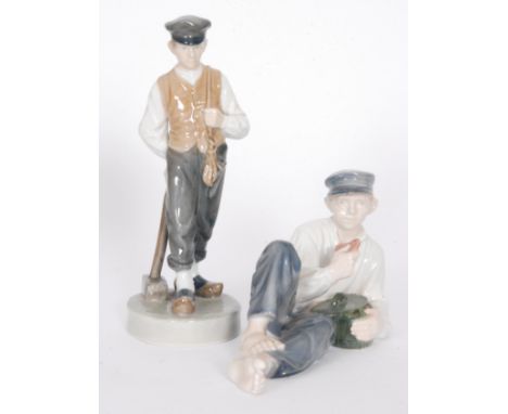Two Royal Copenhagen figures, the first modelled as a young boy holding a hammer and pick, model 620, date code for 1963, the