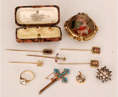 A 19th Century oval portrait miniature containing a Baxter print of the Holy family within yellow metal swivel brooch mount, 