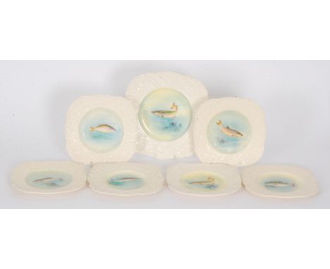 A Royal Worcester Regency Ware fish set comprising one large and six square plates, each decorated with a transfer and hand t