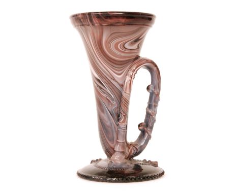 A 19th Century purple malachite footed bugle vase with relief molded decoration, unmarked, height 15cm.