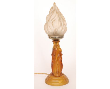 A 1930s press moulded figural table lamp composed of dancing maidens with arms raised below a frosted flame shade, height 45c