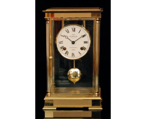 A modern brass and bevelled glass mantle clock by Sewills of Liverpool, the eight-day movement stamped 131-081, height 27cm a