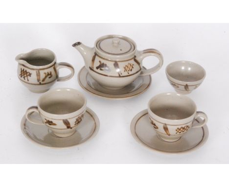 A post war tea for two teaset by Harry and May Davies of Croan Pottery, each decorated in a stone grey glaze with a brown bur