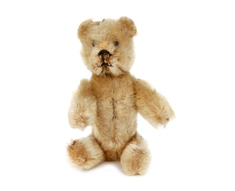 A 1930s teddy bear powder compact blond plush with mirrored interior and detachable head, S/D