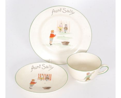 An A. J. Wilkinsons nursery ware teacup, saucer and side plate, transfer printed and painted with a child at a coconut shy an