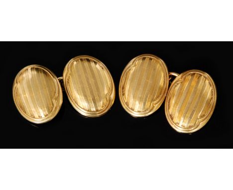 A pair of Victorian hallmarked 18ct gentleman's cufflinks, each oval with engine turned design and united by a chain, Birming