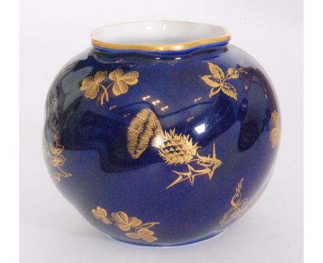 A Royal Worcester cache pot of wrythen ovoid form decorated with gilt thistles, clover leaves and roses against a royal blue 