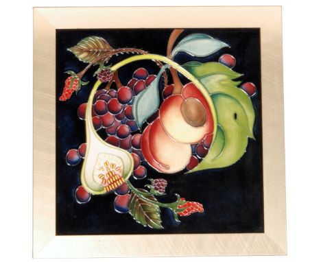 A Moorcroft Pottery Queens Choice pattern square 9in tile plaque designed by Emma Bossons, decorated with tubelined berries a