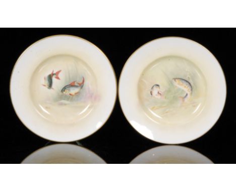 A pair of Royal Worcester hand painted cabinet plates decorated by E.R Booth, the first with brown trout, the second with roa