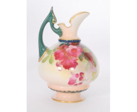 A small Royal Worcester footed ewer of swollen form decorated with crimson flowers and foliage, green printed mark with date 
