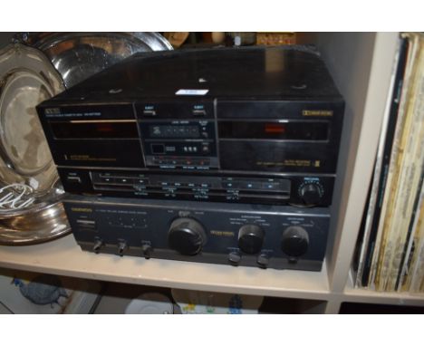 An Akai double cassette player and a Daewoo surround sound amplifier