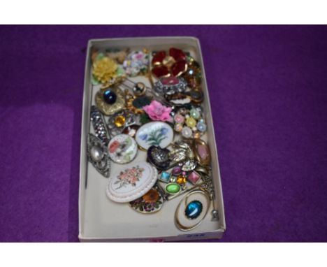 A small selection of costume jewellery brooches including ceramic, enamelled, British Legion etc