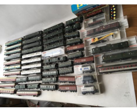 A collection of loose Fleischmann carriages and rolling stock