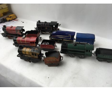 A collection of tinplate clockwork engines and tenders in playworn condition , including Hornby and Chad valley etc