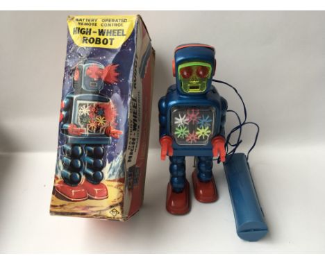 A Japanese boxed, plastic and tinplate, battery operated, remote control, High Wheel Robot