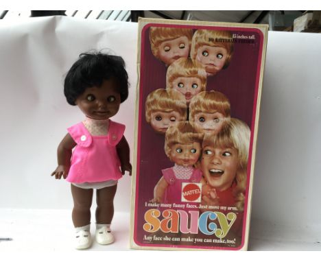 A boxed Saucy doll 15" of fun ,pulling funny faces, made by Mattel