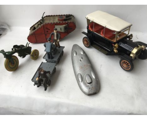 A collection of toys including a battery operated tinplate vintage car, tinplate WW1 Tank probably Marx clockwork with key, a