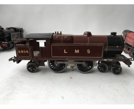 A Hornby clockwork engine LMS numbered 6954 in Brown 0 Gauge
