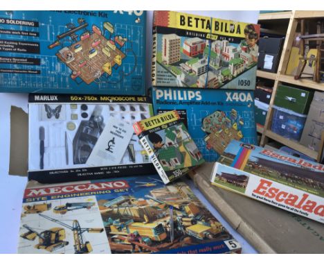 A collection of games including Meccano site engineering set, A Marlux Microscope Set, Escalado, Betta Build sets 1 and 3 and