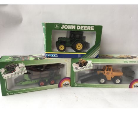 Boxed 1/32 scale diecast farm vehicles including a Ertl John Deere tractor , a Siku boxed forester trailer 3155, a Siku tract