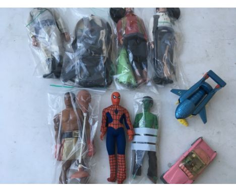 A collection of figures including a Mego Spider-Man (damaged foot), a Mego/ Lincoln Frankenstein, a Mego Mohammed Ali figure 