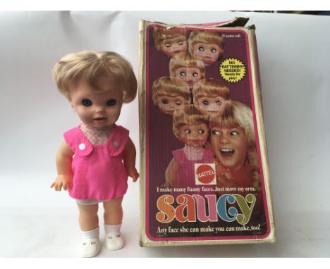 A boxed Mattel " Saucy " doll , makes faces , happy , sad, cheeky etc