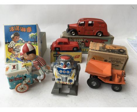 A collection of boxed toys including a boxed Triang Minic Fire Engine, Minic boxed clockwork Dump truck, Minic boxed push and