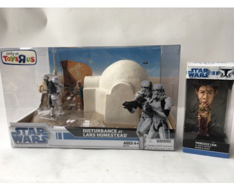 A Star Wars boxed “The Legacy collection”, disturbance at Lars homestead , only sold at Toys r us, also a bobble head boxed f