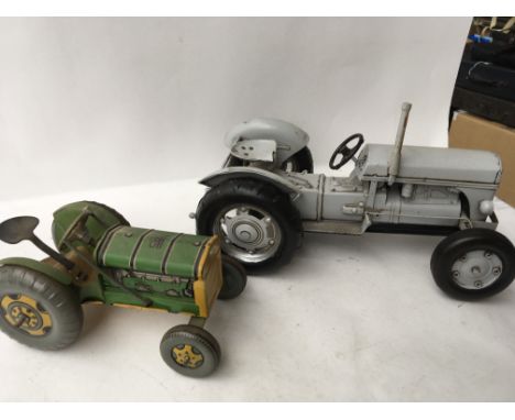 Two Tinplate Tractors , one is a Mettoy playthings tractor and other is a larger more modern example