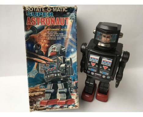 A Japanese boxed, tinplate and plastic , battery operated, Rotate o matic Super Astronaut Robot