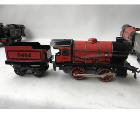 A Hornby clockwork tinplate engine and tender numbered 3435 in red