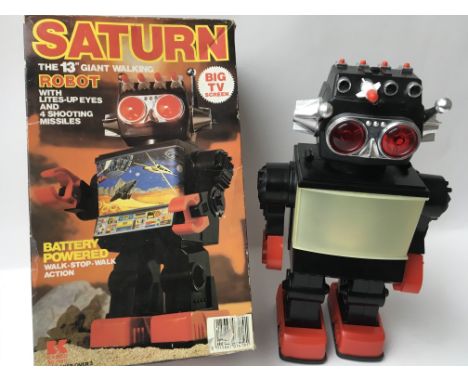 A Japanese Kamco, boxed , plastic , battery operated , Saturn walking Robot