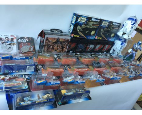 A collection of boxed and carded modern Star Wars Toys including Force awakens titanium ships , carded micro machines, and Ho