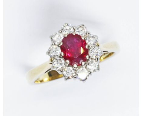 A ruby and diamond ring, the cluster measuring approx. 12mm x 10mm, hallmarked 18ct gold, sponsor 'FEU', London 1996, gross w