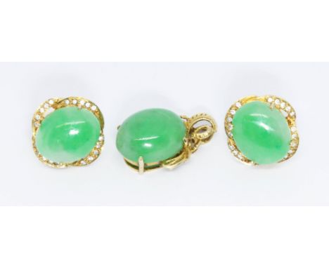 A jadeite jade cabochon pendant and matching earrings set with colourless stones, all pieces marked '18K', pendant length 26m
