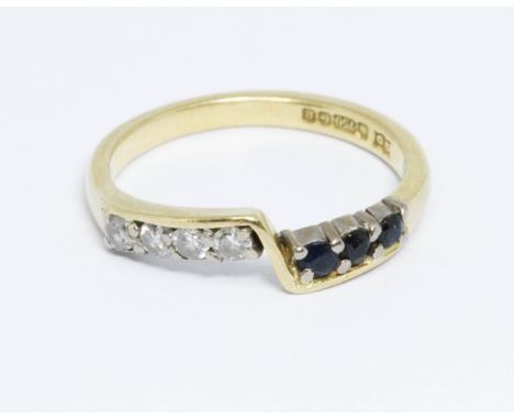 A hallmarked 18ct gold diamond and sapphire ring, gross weight 2.8g, size K.  