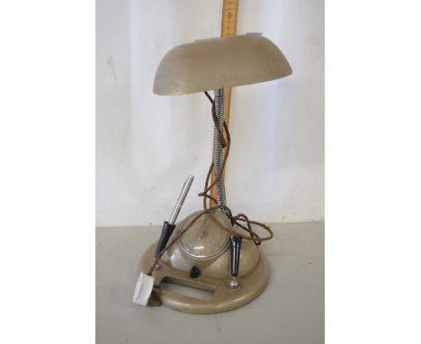 Desk lamp with combined clock and pen holder