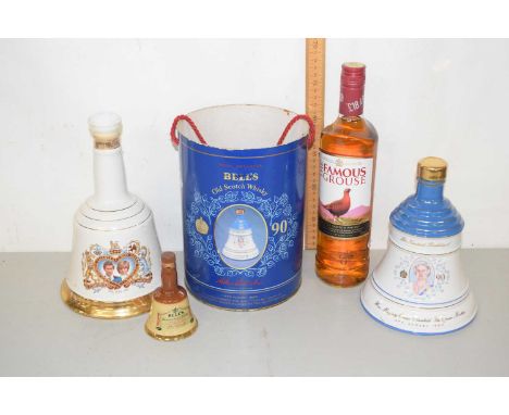 Two Wade Royal commemorative whisky bells (sealed), a further smaller example and a 700ml bottle of Famous Grouse Whisky (sea