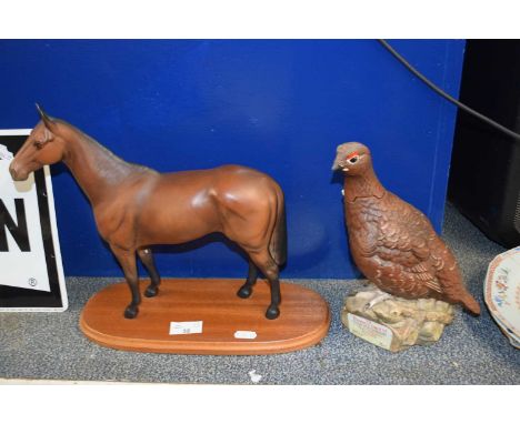 A large Beswick porcelain horse on wooden stand together with a Royal Doulton Famous Grouse Scotch Whisky liquor bottle (2)