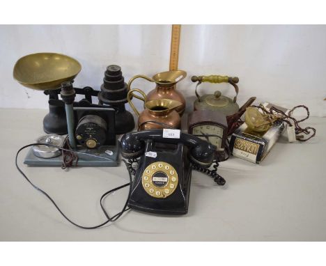 A vintage telephone together with a vintage mantel clock made by Goblin and other brass jugs, set of scales with weights etc