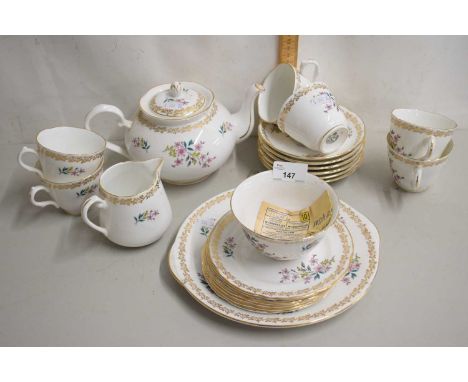 Group of English porcelain tea wares including teapot, milk jug, sugar bowl, cups and saucers etc together with a plated cock
