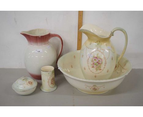 A wash basin set with large jug and basin, early 20th Century together with a soap dish, vase and further large jug