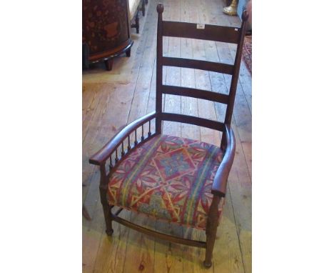 A William Birch for Liberty of London, a walnut Arts &amp; Crafts open ladder back armchair.