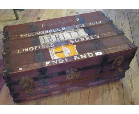 A wood and metal bound travelling trunk.