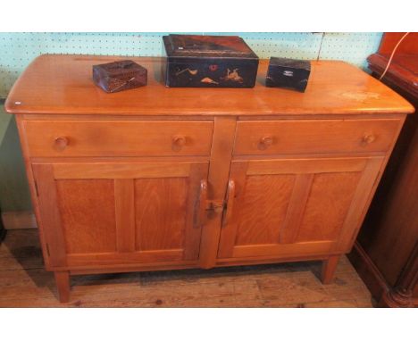 A contemporary light oak dresser base.