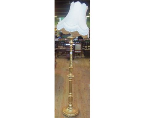A gilt painted standard lamp.